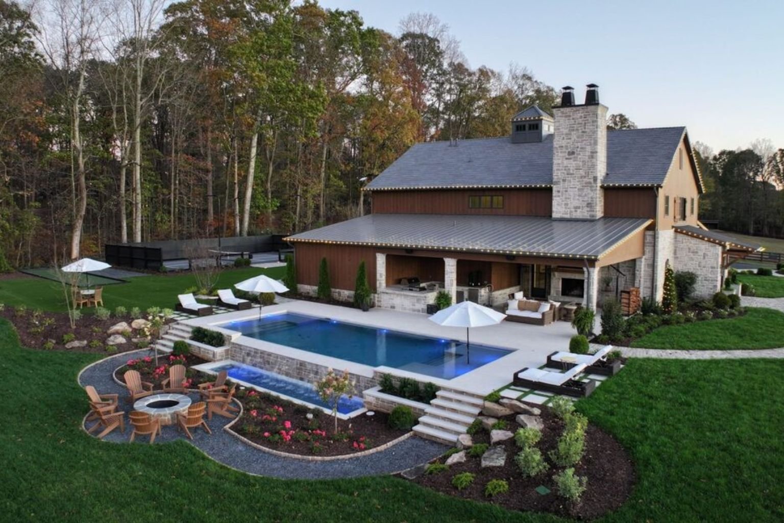 Private pool and fire pit at a poolside bachelor party villa in Manesar