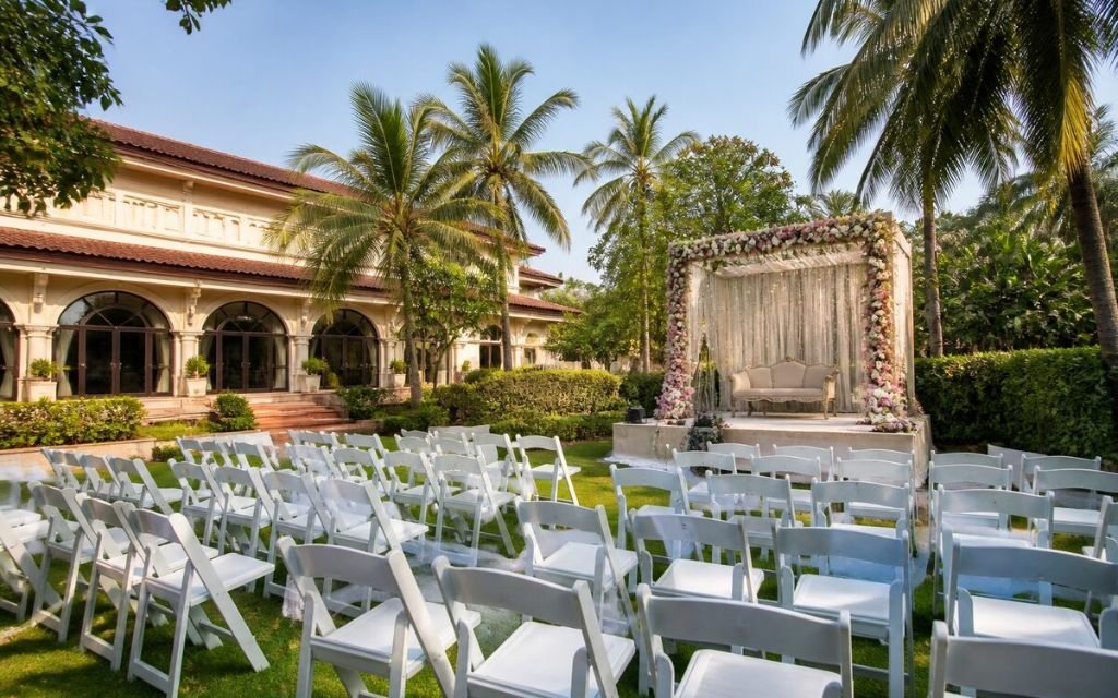Resort garden with event seating and a floral stage set up for an engagement party in Manesar