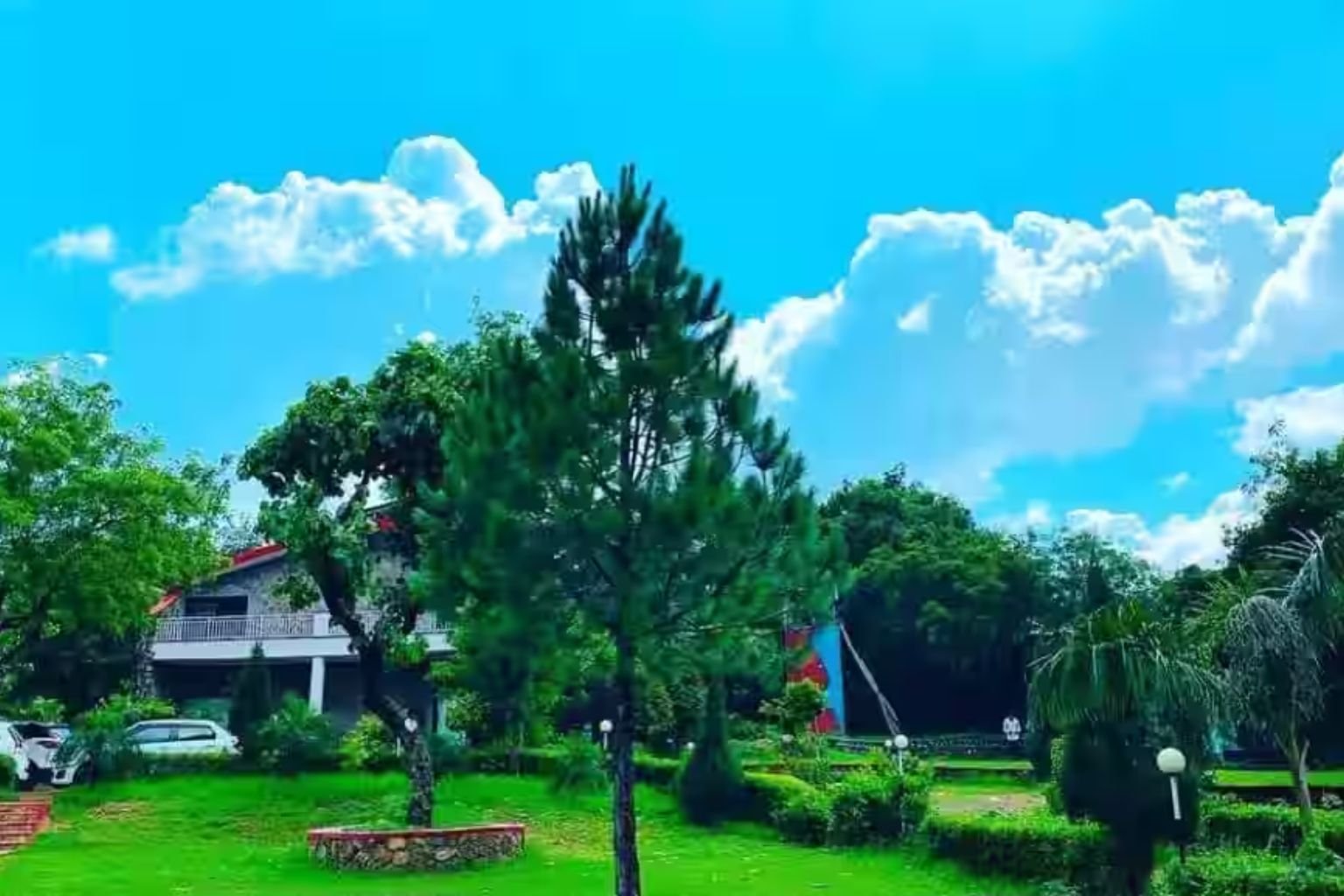 Kingfisher Aravali Resort lawns and pool on Sohna Road, Gurugram