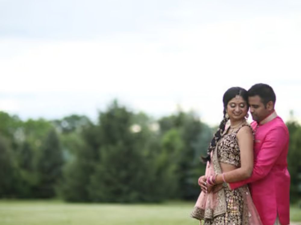 Couple during a pre wedding photoshoot in a garden setting